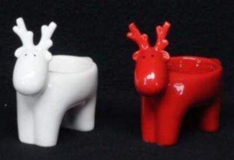 Very cute ceramic reindeer night lights T Light candle holders by Gisela Graham. They come in a choice of red or white if preference please specify when ordering, or you can purchase them both. Gisela Graham are a well known brand, recognised for their unique and high quality products she has a beautiful range of candle holder for both Christmas and everyday Size 10x9.5x5.5cm<br><br>
If it is Christmas Decorations to be sent anywhere in the UK you are after than look no further than Booker Flowers and Gifts Liverpool UK. Our Tree Decorations are specially selected from across a range of suppliers. This way we can bring you the very best of what is available in Tree Decorations.<br><br>
Reindeers are a really festive motive and Gisela Graham has lots of beautiful reindeer in her collection. Christmas Tree Decorations, candle holders, and ornaments. If it is reindeer you love look no further than Gisela Graham Reindeer for beautiful Christmas Decoration.<br><br>
Gisela loves Christmas Gisela Graham Limited is one of Europes leading giftware design companies. Gisela made her name designing exquisite Christmas and Easter decorations. However she has now turned her creative design skills to designing pretty things for your kitchen - home and garden. She has a massive range of over 4500 products of which Gisela is personally involved in the design and selection of. In their own words Gisela Graham Limited are about marking special occasions and celebrations. Such as Christmas - Easter - Halloween - birthday - Mothers Day - Fathers Day - Valentines Day - Weddings Christenings - Parties - New Babies. All those occasions which make life special are beautifully celebrated by Gisela Graham Limited.<br><br>
Christmas and it is her love of this occasion which made her company Gisela Graham Limited come to fruition. Every year she introduces completely new Christmas Collections with Unique Christmas decorations. Gisela Grahams Christmas ranges appeal to all ages and pockets.<br><br>
Gisela Graham Christmas Decorations are second not none a really large collection of very beautiful items she is especially famous for her Fairies and Nativity. If it is really beautiful and charming Christmas Decorations you are looking for think no further than Gisela Graham.<br><br>
These beautiful Reindeer Christmas Candle holder Christmas decorations by Gisela Graham will delight for years to come. In a choice of Red or White they will compliment any Christmas Decoration. These Reindeer will bring Christmas cheer at Christmas time for years to come. Remember Booker Flowers and Gifts for Reindeer T Light Candle Holder Gisela Graham Christmas Decorations.
